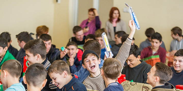 Boy celebrates receiving toothbrush