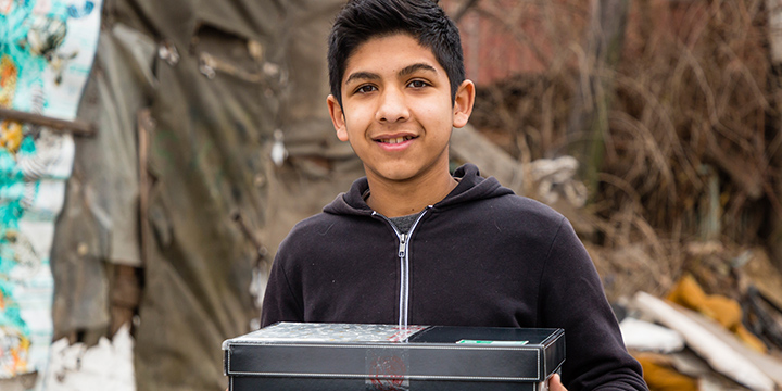 Boy holding shoebox gift