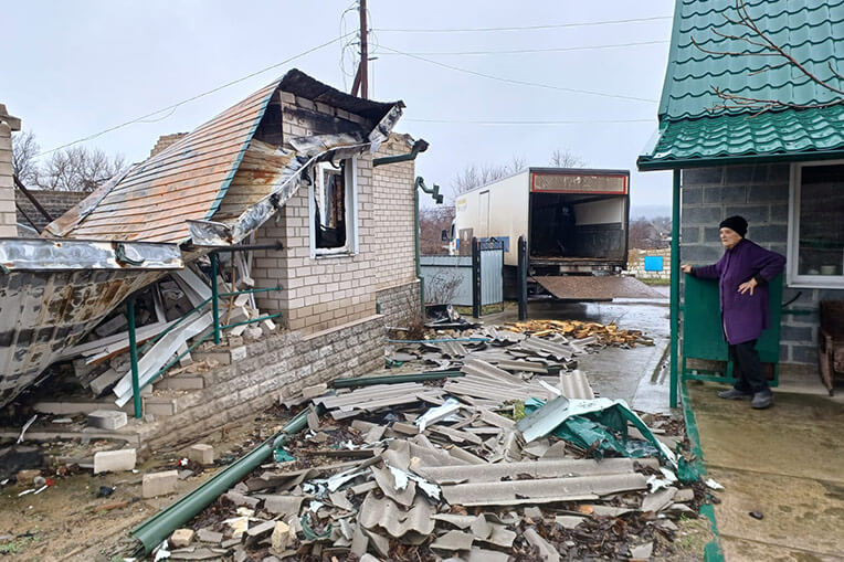 Vera and her team delivered food and a wood stove to this woman who had witnessed destruction so close to her home.