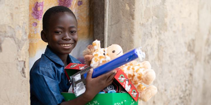 Boy holding shoebox gift