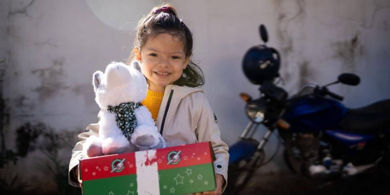 Bianca loves dogs above anything else. She was overjoyed to see a special stuffed animal dog in her shoebox gift.