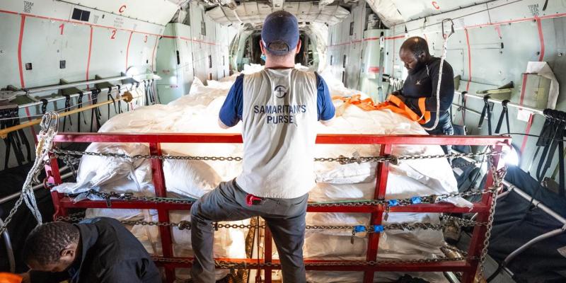 The cargo plane was packed with sacks of maize, beans, and salt for hungry displaced Sudanese in remote locations.