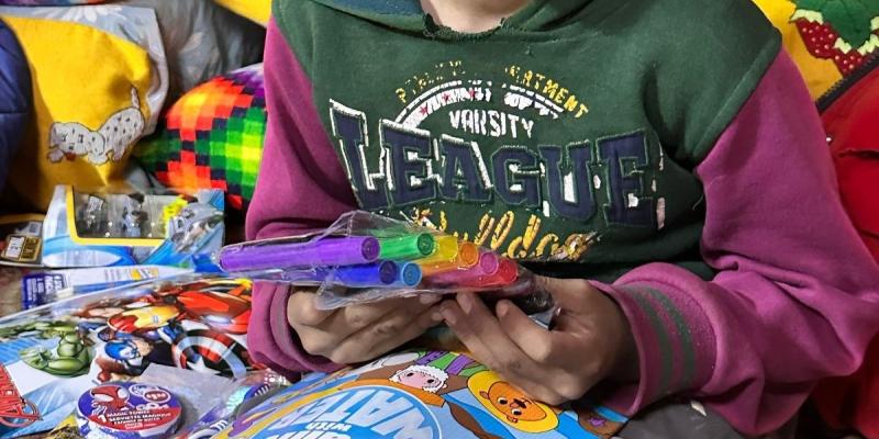 This precious boy was thrilled with his new art supplies!