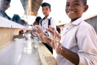 boy washing hands