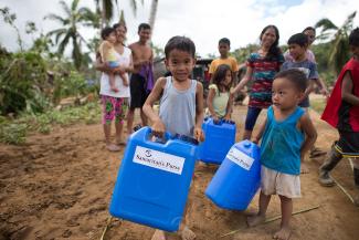 children with jerry cans