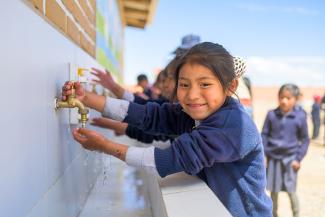 girl at handwashing station