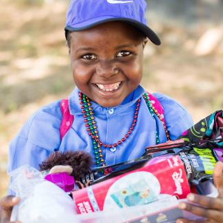 Girl smiles wearing her new accessories