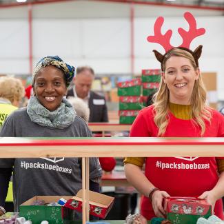 volunteers processing shoebox gifts