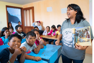 Children being taught The Greatest Journey in a classroom