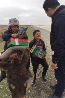 The two brothers take a break from tending their sheep to talk to Yusif on the side of the road.