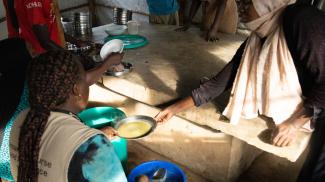 Displaced families receiving hot meal