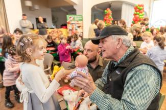 Franklin Graham shares a toy with a child