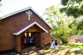 Nurses enter the chapel one Wednesday morning at Nkhoma Hospital in Malawi.