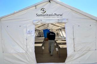 A DART member walks through a completed ward of our emergency field hospital in Sudan.