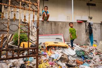 Even children pick through trash in search of valuables in Cambodia’s slums.