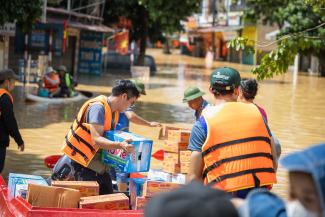 Samaritan’s Purse teams use boats to carry supplies to families still stranded in their homes.
