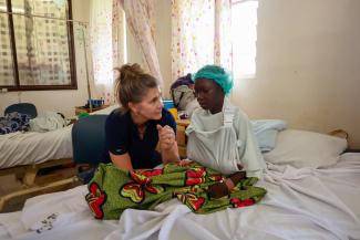 Schuster talks with Hellen as she works through rehabilitation for her elbow. “It’s the honor of my life to serve these patients,” she said about her experience working with Samaritan’s Purse in Nigeria.