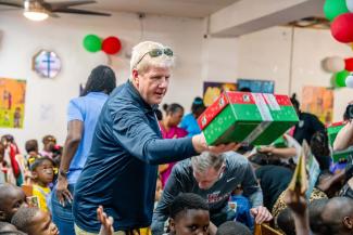 Jonathan Falwell helps distribute Operation Christmas Child shoebox gifts to children in Jamaica, reminding young families recovering from Hurricane Melissa that God loves them and has not forgotten them.