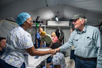 Franklin Graham greets medical staff inside the Samaritan’s Purse Emergency Field Hospital in Black River, thanking them for their tireless service to families recovering from Hurricane Melissa.