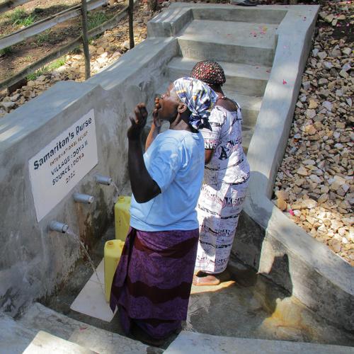 lady at water source